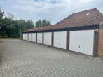 RUDNICK bietet vermietete 3-Zimmer-Eigentumswohnung mit Garage und Balkon - Garagen