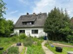 RUDNICK bietet TRAUM für TIER-/, Garten- und Ruheliebhaber: Haus mit 2 Wohnungen auf 3.700 qm Grd. - Haus Gartenseite
