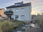 RUDNICK bietet MEHRFACH-POTENZIAL - 4-Parteienhaus in bester Lage - Hausansicht (hinten)