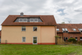 RUDNICK bietet: Solide Kapitalanlage mit Entwicklungspotenzial: Mehrfamilienhaus mit 4 Wohneinheiten - Haus Seitenansicht