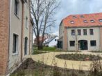 RUDNICK bietet ERSTBEZUG: Citynahes Wohnidyll + Wärmepumpe + Photovoltaik... - Blick auf den Innenhof