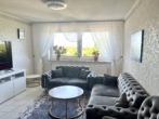 RUDNICK bietet KAPITALANLAGE: 3-Zimmer-Wohnung mit Balkon und Fahrstuhl - Wohnzimmer