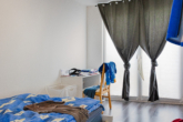 RUDNICK bietet 3-Familienhaus mit Blick aufs Landschaftsschutzgebiet - Schlafzimmer EG Neubau