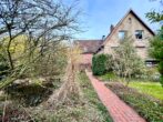 Rudnick bietet BEZAHLBAR + POTENTIAL: Doppelhaushälfte auf Eckgrundstück mit Erweiterungspotential - Gartenansicht