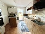 RUDNICK bietet EINZIEHEN UND WOHLFÜHLEN: schönes Einfamilienhaus für die Familie - Küche mit Zugang zum Garten
